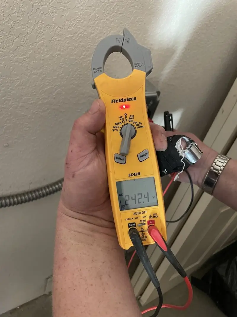 Voltage testing with clamp meter during Outlet Installation in Upper Makefield